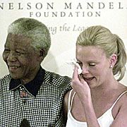 Nelson Mandela and Charlize Theron